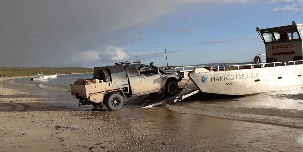 No room here for a caravan here, even a small 16fter. That's why you need to pack a tent on tour as well. A muddy grey 4WD ute drives up a metal ramp from a sandy beach onto the 'Hartog Explorer' barge. 