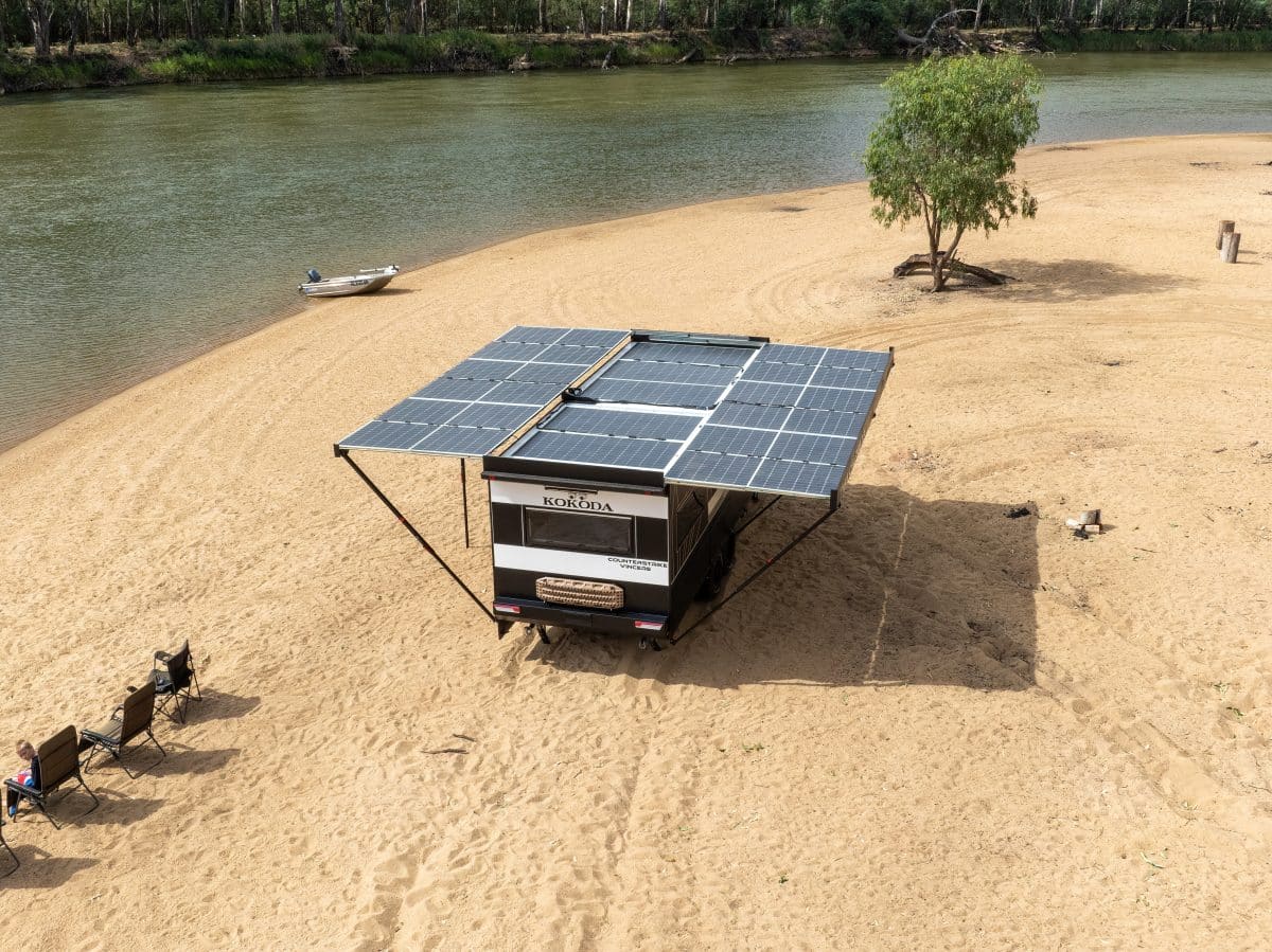 kokoda caravan counterstrike vincere on beach near river