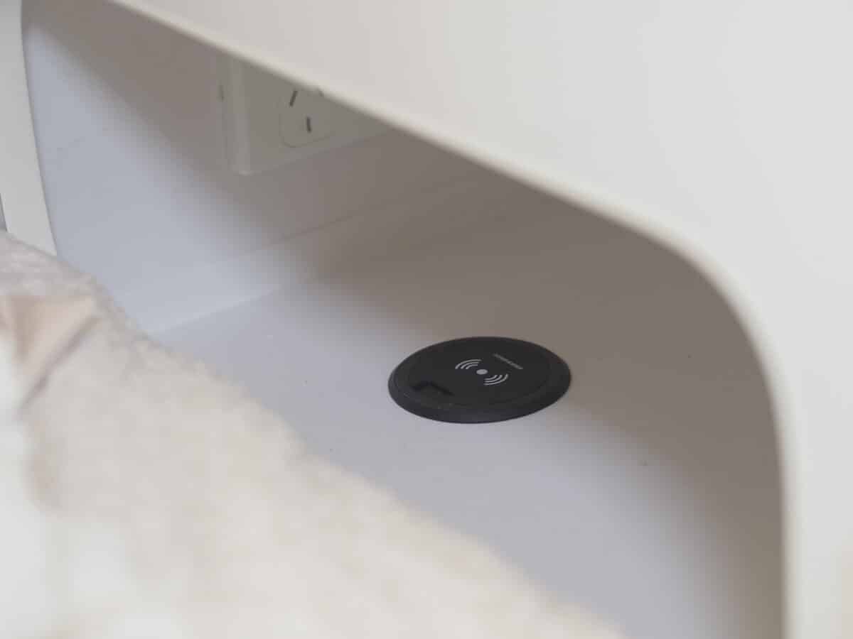 a closeup of a storage nook featuring an inbuilt wireless charger