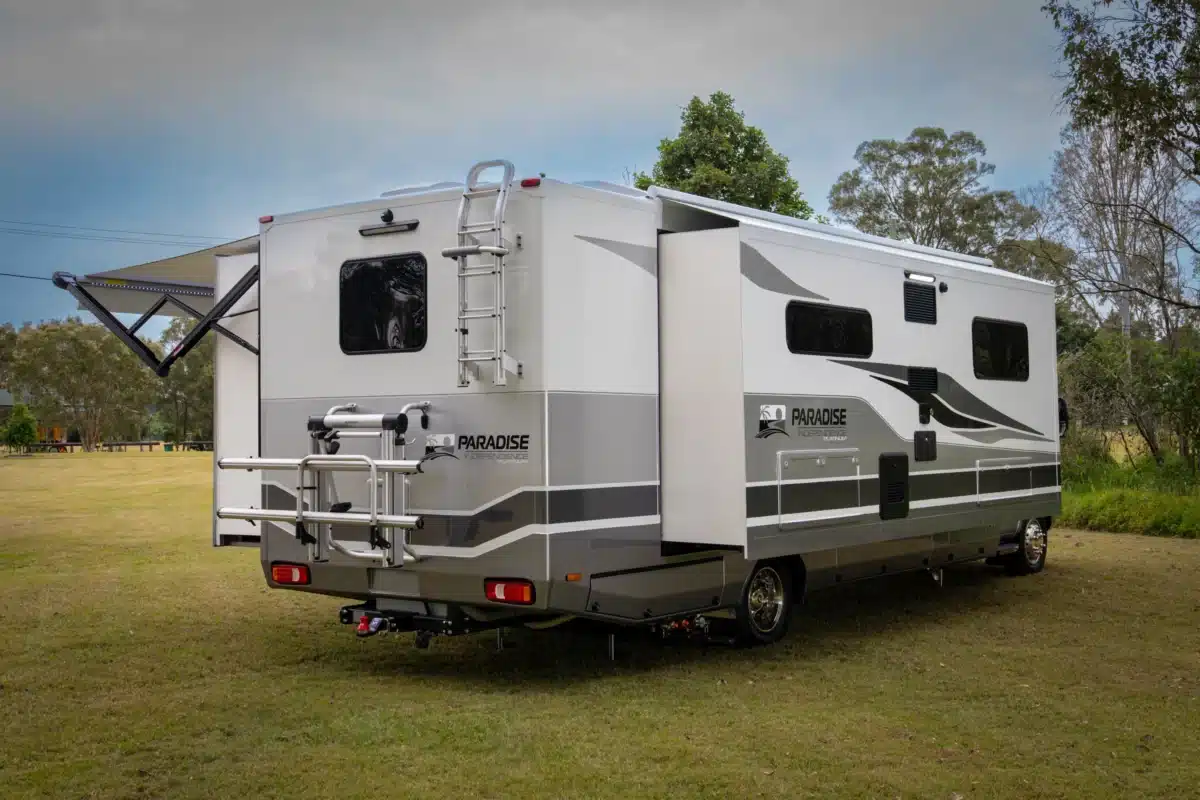 Rear three-quarter view of the Paradise Independence Platinum motorhome in travel mode