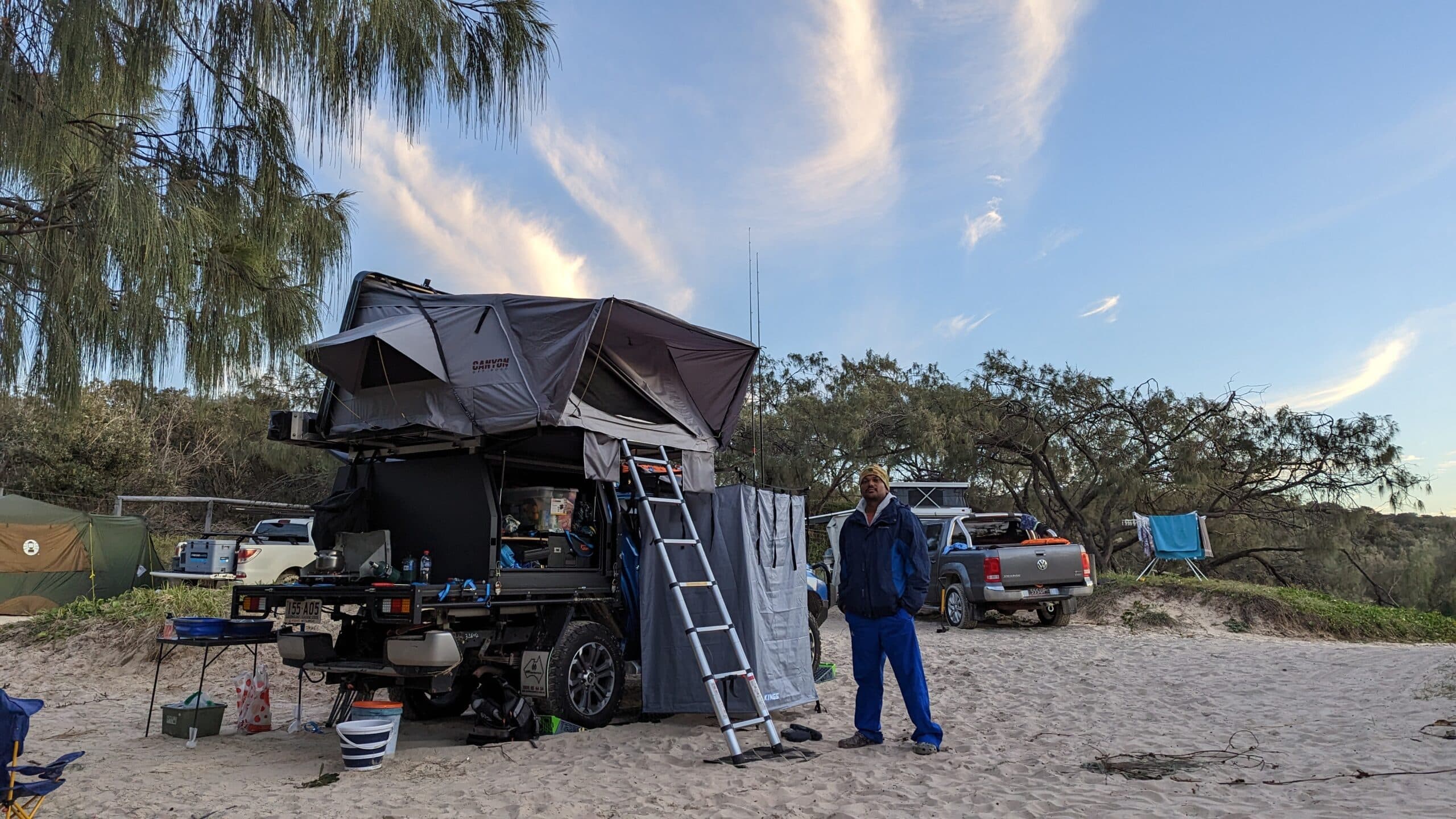 Australian man standing next to his off grid 4wd touring set up