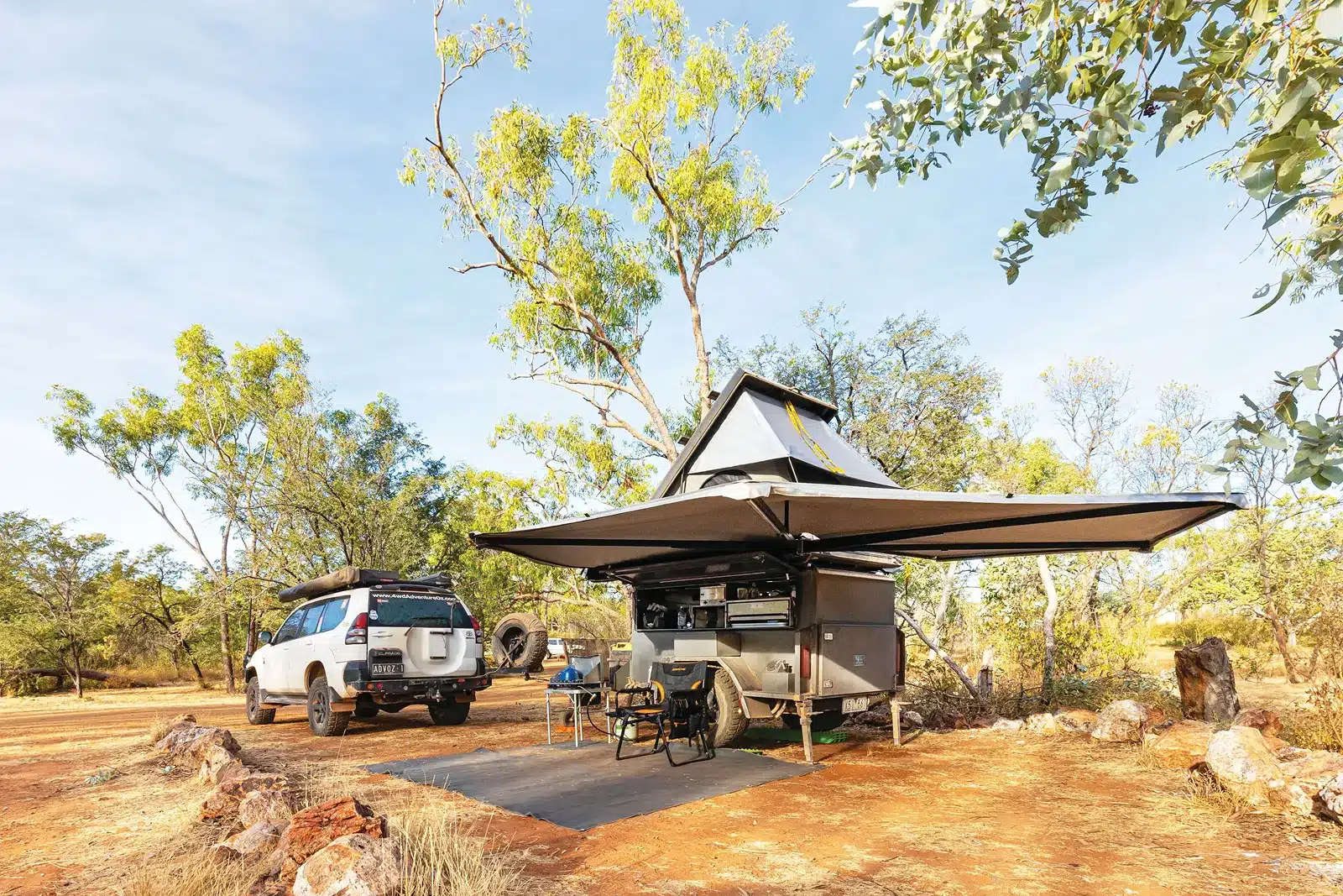 Camping setup in dry bushland conditions during hot summer weather in Australia.