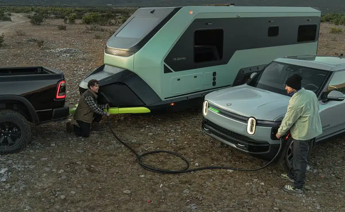 Evotrex PG5 RV trailer supplying power to an electric vehicle at an off-grid campsite