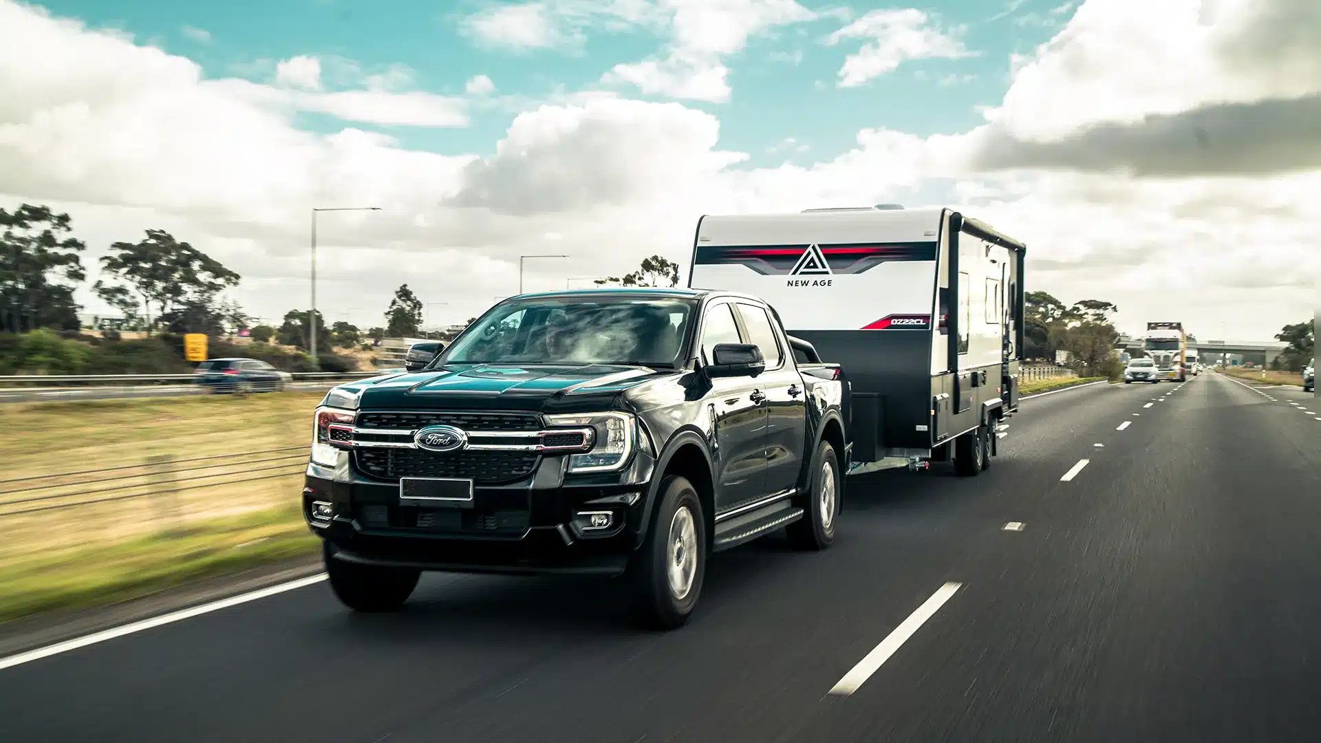 4WD towing caravan on Australian highway during peak travel period