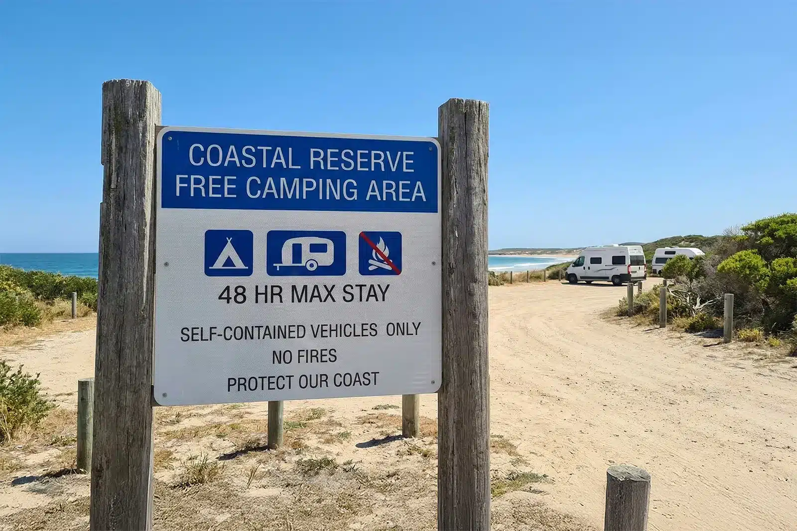 Sign showing coastal reserve free camping area rules including 48-hour stay and self-contained vehicles only